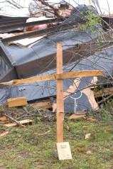 ###Ocala Star-Banner - Day after tornados in the Lake Mack area, Deland, FL### A cross with a Bible rests beside the remains of a mobile home of the late Jamie Wright(cq), age 55, that died along with her fiance Scott Lamond(cq) age 50, in the early Friday morning tornados near Lake Mack. The area is located east of Paisley and west of Deland and just south of Lake County Road 42, Saturday afternoon, Feb. 3, 2007, Deland, FL. ( Jannet Walsh/Star-Banner)2007