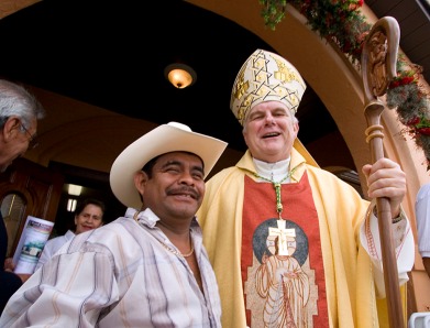 ###First Visit of Bishop Wenski, Ocala, Fla. ###First Visit of Bishop Wenski to Catholic Center Our Lady of Guadalupe and St. Anthony Convent Sergio Flores, left, orginally from Mexico, now of Ocala, poses with Bishop Thomas Wenski after Mass. Flores is wearing a hat very typical of Mexican wear. He started to take his hat off, but the bishop told him to wear his hat also. Diocese of Orlando Bishop Thomas Wenski made his first ever visit to Catholic Center Our Lady of Guadalupe and St. Joseph Convent on Sunday afternoon, March 30, 2008. The convent is home to the Missionary Sisters Catechist, or in Spanish, Hermanas Misioneras Catequistas, that arrived in Ocala on Jan. 30, 2007, from Medelln, Colombia. This is the religious orderÕs only convent in the United States and officially had their convent blessed and opened April 22, 2007. Bishop Wenski celebrated the Mass with Father Alfonso Cely and Father Patrick Sheedy and Deacon Eddie Berrios, all of Blessed Trinity Catholic Church, Ocala. Father Cely estimated that more than 400 people attended the Mass, packed from wall to wall, with folding chairs. The Tuna La Trinidad de Blessed Trinity, of Ocala, a Spanish style musical band, typical of the European minstrels musicians, performed complete with black capes, serenading the Bishop by the altar and also outside during a luncheon. The to Catholic Center Our Lady of Guadalupe officially opened in 2002. The Catholic Center and convent are both located at 1153 W. State Road 40, Ocala. Prior to 2002, the growing Hispanic communities of mainly Mexicans working in the rural Marion County horse farms were celebrating Mass and services in backyards and at a local horse farm barn prior to the opening of Catholic Center Our Lady of Guadalupe, Sunday afternoon, March 30, 2008, Ocala, Fla. (Jannet Walsh/Freelance to The Florida Catholic)2008