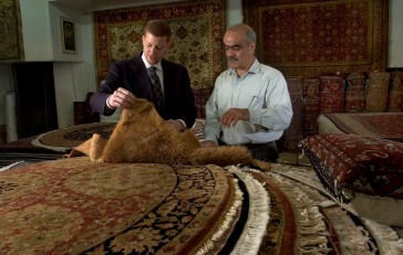 ### Bahram Cyrus Assary (cq) right, owner of the Cyrus Rug Gallery, Ocala### Dr. Jamal Fakhoury (cq) left, of Ocala, a local chiropractor, chats about Persian rugs with Bahram Cyrus Assary (cq), owner of the Cyrus Rug Gallery, Saturday afternoon, April 9, 2005, Ocala, FL, USA. (Jannet Walsh/Star-Banner)2005