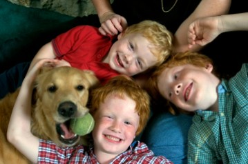 ###Rare Redhead: Michael and LuAnne Warren family of five redheads and red haired dog, Ocala### Redheaded parents LuAnne Warren, 42, and Michael Warren, 36, do their best to sit with their three active red haired boys. Jonathan Warren, 3, top, Paul Warren, 6, center, and Matthew Warren, 8, all have fun with Jenny the Golden Retriever, also a redhead, Monday evening, April 11, 2005, Ocala, FL, USA. (Jannet Walsh/Star-Banner)2005