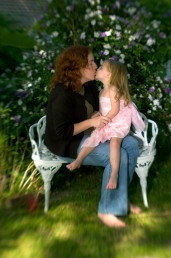###Rare Redhead: Brooke Cole, 26, Ocala### Redheaded Brooke Cole, 26, left, gets a kiss from her daughter Symon Cole, 4, with blonde hair, both of Ocala, a garden in the Ocala Historic District. Brooke required additional pain relievers while giving birth to her daughter Symon Cole, now age 4. There is research about redheads that finds them more senitive to pain, Thursday afternoon, April 14, 2005, Ocala, FL, USA. (Jannet Walsh/Star-Banner)2005
