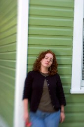 ###Rare Redhead: Brooke Cole, 26, Ocala### Redheaded Brooke Cole, 26, of Ocala, with Gerber Daisy in her hand from her garden, leans up against a home in the Ocala Historic District. Brooke required additional pain relievers while giving birth to her daughter Symon Cole, now age 4. There is research about redheads that finds them more senitive to pain, Thursday afternoon, April 14, 2005, Ocala, FL, USA. (Jannet Walsh/Star-Banner)2005