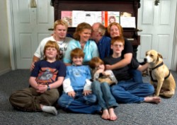 ###Rare Redhead: Family of eight redheads: Russell and Linda Rock, both redheads, and their six redheaded children, of the Florida Highlands### In the beginning there was just Linda Russell, 47, and her husband Russell Rock, 48, both redheads, that married 22 years ago. Russell's red hair has grayed and become darker, with a receding hairline. Today they have six children, all with red hair, with the ages of 8 to 21. The family left right, front row, Wesley Rock, 12; Ian Rock, 10; Olivia Rock, 8 and Caleb Rock, 15, hold the family dog. Back row, left to right: Sam Rock, 21; Linda Rock, 47; Russell Rock, 48, and Nathaniel Rock, 19. The family of redheads all live together, Monday evening, April 25, 2005, Florida Highlands, FL, USA. (Jannet Walsh/Star-Banner)2005
