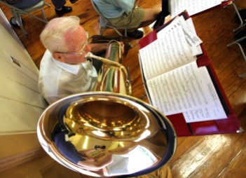 ###NEWS Kingdom of the Sun Concert Band practices at Osceola Middle School, Ocala FL CONTACT PHOTOGRAPHER 352-598-7976 - cell### Vernon Feiler(cq) age 85, of Ocala, started playing a tuba in high school in 1934. Here he plays his Double B Flat tuba with other members of the Kingdom of the Sun Concert Band, Thursday evening, August 4, 2005, Ocala, FL. ( Jannet Walsh/Star-Banner)2005
