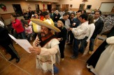 Ocala Star-Banner - Advent: Our Lady of Guadalupe Catholic Center, known in Spanish as La Guadalupna, Advent celebrations, Ocala, FL - Fernando Veloz of Ocala, wearing a large Mexican hat, leads songs of Our Lady of Guadalupe about 2:30am Monday. An estimated 700 people attended a special Advent program, the four weeks prior to Christmas, starting shortly after midnight on Monday, Our Lady of Guadalupe Catholic Center, and also known in Spanish as La Guadalupna, located at 11153 W. State Road 40, in the "Little Mexico" area of rural horse farms, awaited the arrival of the Los Caporales Mariachi, of Tampa. The celebration or feast day of the patroness of the center Our Lady of Guadalupe is traditionally celebrated in Mexico with a serenade starting just after midnight on December 12, according to Father Cely, with the Hispanic Ministry of Blessed Trinity Catholic Church. Father Cely ministers to a many Mexican parish at Our Lady of Guadalupe with special celebrations and customs from Mexico. Nine days of special prayers, Masses, recitation of the Rosary, started the special Advent program that is of Mexican origin for Our Lady of Guadalupe, Monday morning, December 12, 2005, Ocala, FL. ( Jannet Walsh/Star-Banner)2005