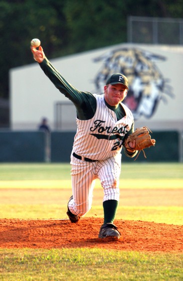 ###Forest High School vs. Gainesville High School at old Forest baseball field###Forest High School's Doug Stickley (24), pitches in the opening of the game against Gainesville High School in a district tournament game, Thursday evening, April 21, 2005, Ocala, FL, USA. (Jannet Walsh/Star-Banner)2005