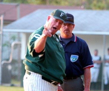 ###Forest High School vs. Gainesville High School at old Forest baseball field###Forest High School's coach Wayne Yancy, left, argues a play in favor of his player that was out at third base in a game against Gainesville High School in a district tournament game, Thursday evening, April 21, 2005, Ocala, FL, USA. (Jannet Walsh/Star-Banner)2005