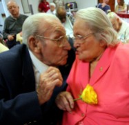 ####Pauline and Earl Raub celebrating 80th wedding anniversary at Avante Nursing and Rehab Center, Leesburg##Earl Raub, 96, and wife Pauline Raub, 95, both of Weirsdale, but Pauline currently is a resident of Avante Nursing and Rehab Center in Leesburg. Here the couple kiss at their 80th wedding anniversary with singing by Bob Rodgers, of Ocala. Their daughter Paulina Maxson, (cq) 77, of Weirsdale, was on hand for the celebration. The couple is possibly the oldest known current married couple in the United States, and possibly second to a couple in England. When asked how long they have been married, Pauline state, "It's been a long time gone." Sunday afternoon, June 5, 2005, Leesburg, FL, USA. (Jannet Walsh/Star-Banner)2005