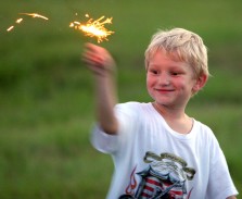 ###NEWS - The Jaycees God and Country Day, Ocala - CONTACT PHOTOGRAPHER 352-598-7976 - cell### James "Bo" McGraw (cq) age 5, of Anthony, plays with a sparkler before the fireworks started at the Golden Hills Golf and Turf Club, located on U.S. 27, about four miles west of Interstate 75, Monday evening, July 4, 2005, in Ocala, FL. (Jannet Walsh/Star-Banner)2005