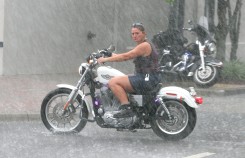 ###NEWS - 2005 Ocala Sturgis Rally, Ocala CONTACT PHOTOGRAPHER 352-598-7976 - cell### A motorcyclist looks for a place to park in rain and thunder storm. The 2005 Ocala Sturgis Rally, with many motorcycles on display around the Ocala downtown square, even in the rain, Friday evening, July 29, 2005, Ocala, FL. ( Jannet Walsh/Star-Banner)2005
